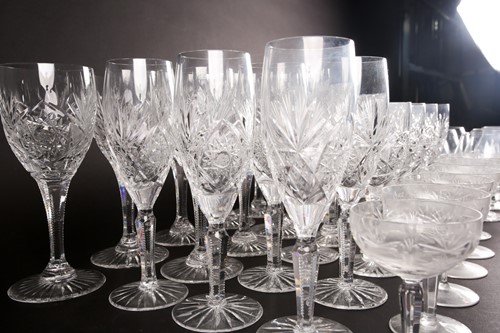 Lot 405 - A part suite of cut glass drinking glasses,...