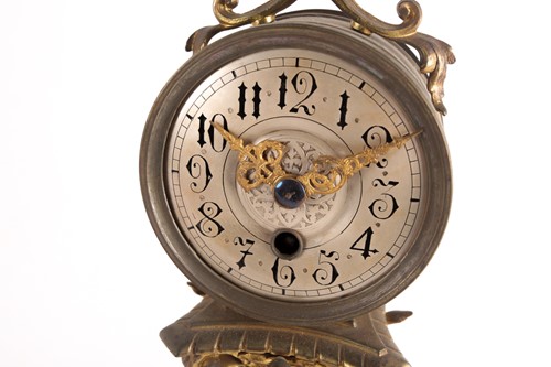Lot 434 - A Victorian gilt spelter mantel clock, set...