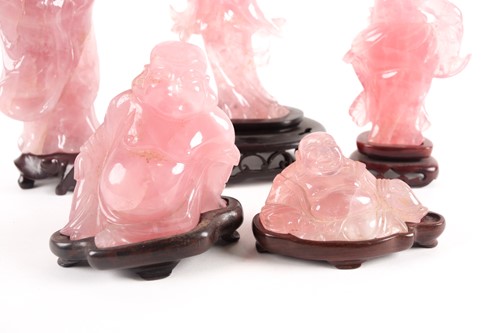 Lot 34 - A group of Chinese rose quartz carved deities,...