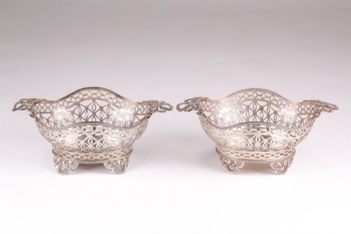 Lot 571 - A Pair of Edwardian silver baskets. London...