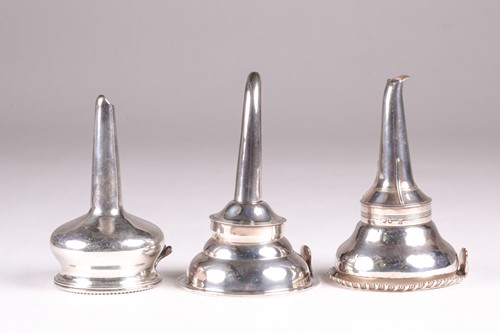 Lot 556 - Two silver wine funnels