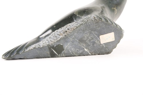Lot 444 - An Inuit serpentine marble seal, 20th century,...