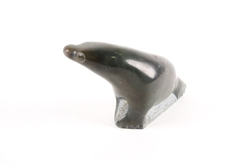 Lot 444 - An Inuit serpentine marble seal, 20th century,...