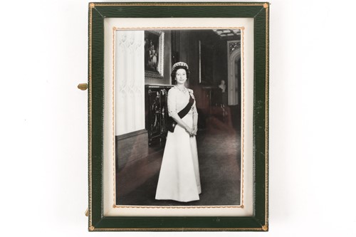 Lot 498 - A framed presentation photograph of HM Queen...