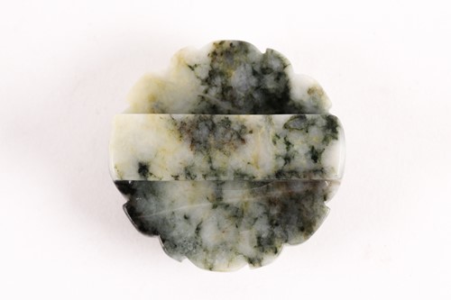 Lot 145 - A Chinese white and spinach green jade...