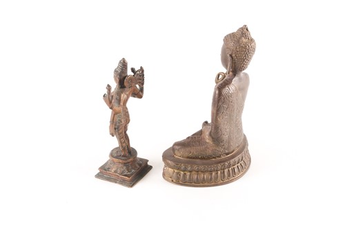 Lot 158 - A Tibetan bronze figure of Buddha, seated in...