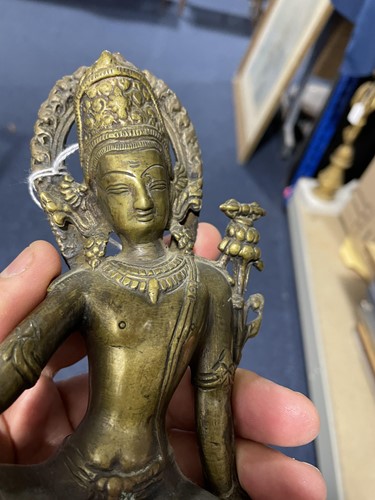 Lot 141 - A Sino Tibetan patinated bronze figure of...