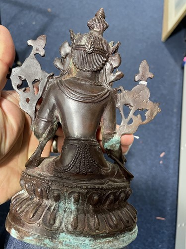 Lot 141 - A Sino Tibetan patinated bronze figure of...