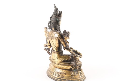 Lot 167 - A Sino Tibetan gilt-bronze figure of green...