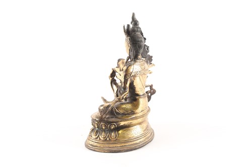 Lot 167 - A Sino Tibetan gilt-bronze figure of green...
