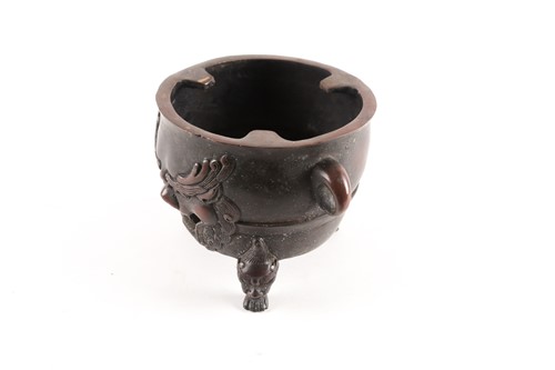 Lot 151 - A Chinese patinated bronze circular charcoal...