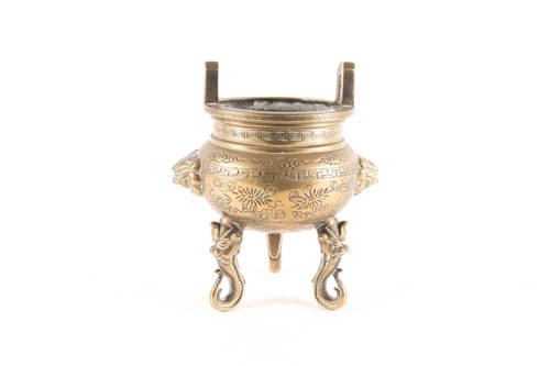 Lot 60 - A Chinese bronze two-handled tripod censer...