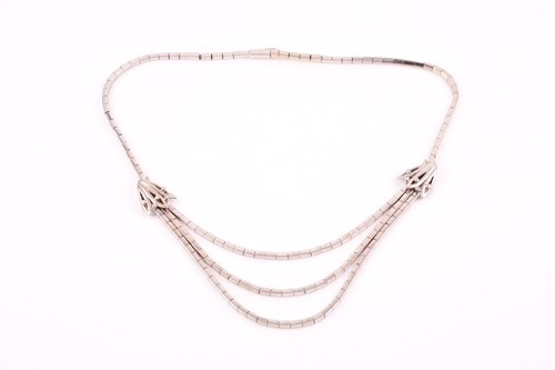 Lot 479 - A white metal necklace, with three strands of...