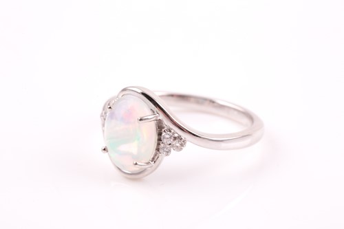 Lot 209 - A platinum, diamond, and Welo opal ring, the...
