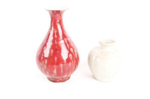 Lot 159 - A Chinese white glazed segmented globular vase,...