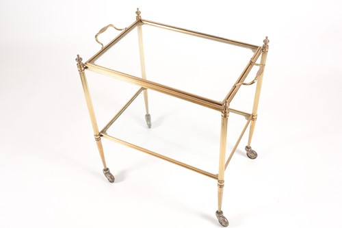 Lot 301 - A brass and glass two-tier trolley on castors,...