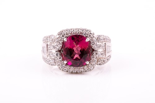 Lot 475 - A pink tourmaline and diamond dress ring; the...