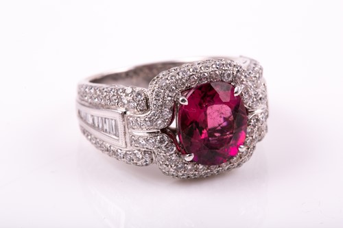 Lot 475 - A pink tourmaline and diamond dress ring; the...