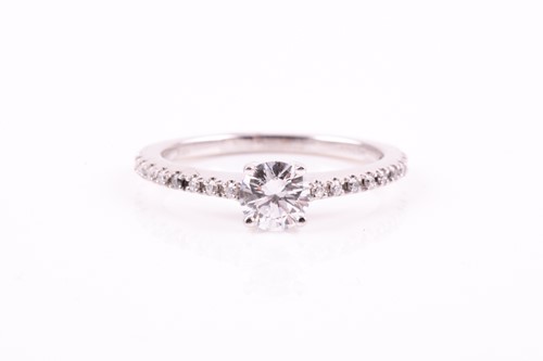 Lot 49 - A single stone diamond ring, the round...