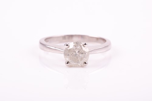 Lot 308 - A single stone diamond ring, the round...