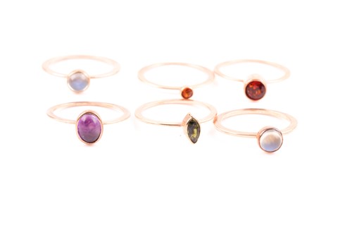 Lot 83 - A set of six yellow metal and gemstone rings,...