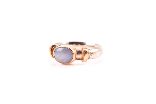Lot 194 - A 9ct yellow and white gold and star sapphire...