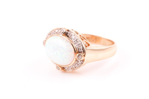 Lot 136 - A 14ct yellow gold, diamond, and opal ring,...