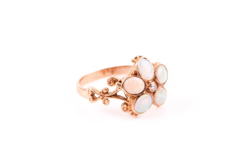 Lot 129 - A 9ct yellow gold and opal floral ring, set...