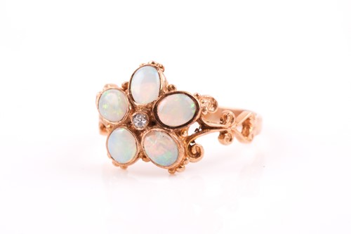 Lot 129 - A 9ct yellow gold and opal floral ring, set...