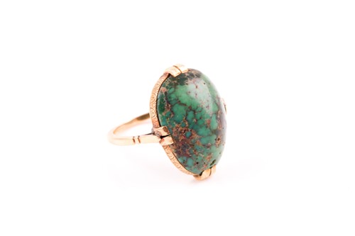 Lot 33 - A yellow metal and turquoise ring, set with a...