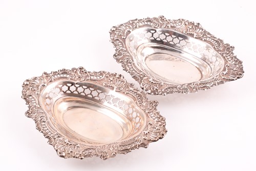 Lot 563 - A pair of silver bonbon dishes. London 1900 by...