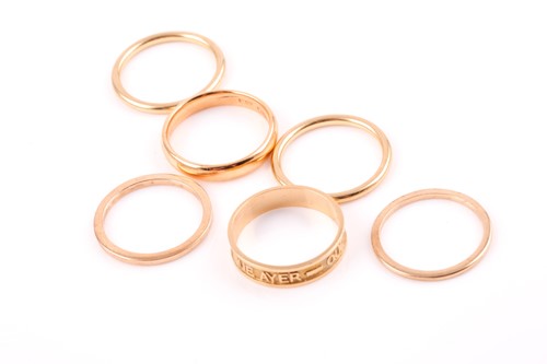Lot 13 - A group of gold rings, including a set of four...
