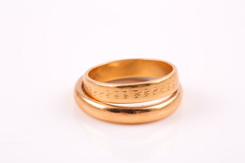 Lot 188 - A yellow metal wedding band ring with white...