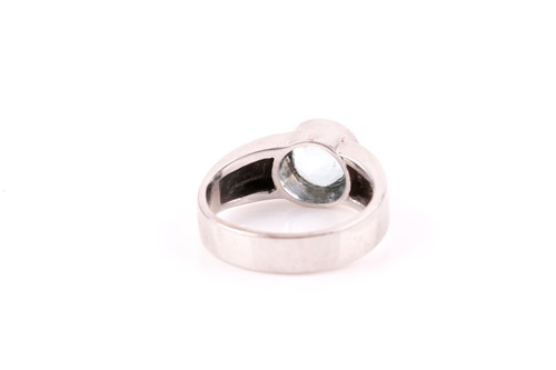 Lot 71 - A white metal and aquamarine ring, collet-set...