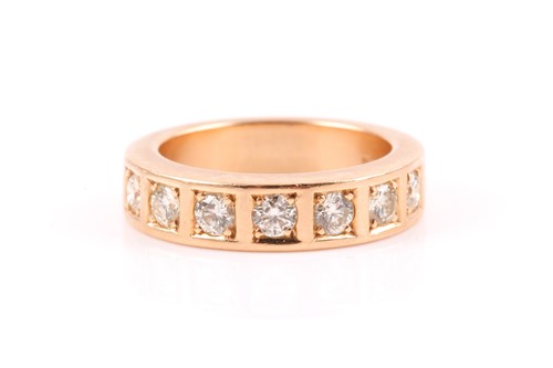 Lot 218 - An 18ct yellow gold and diamond band ring, the...