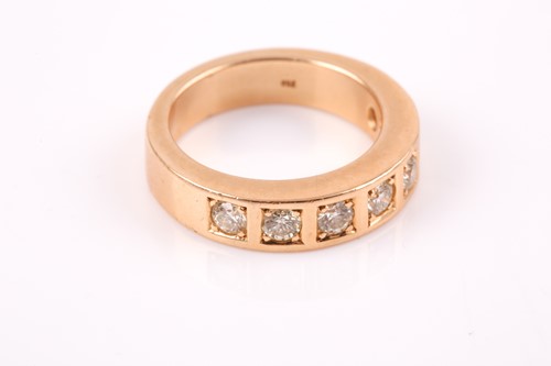 Lot 218 - An 18ct yellow gold and diamond band ring, the...
