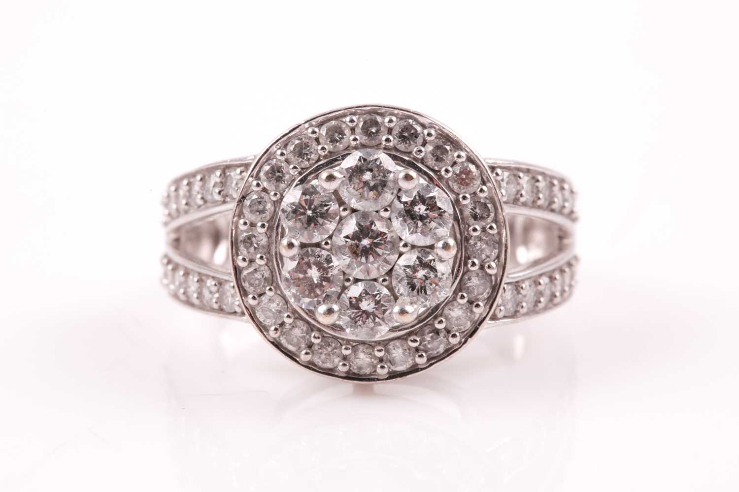 Lot 81 - A 14ct white gold and diamond cluster ring, by...