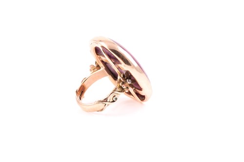 Lot 64 - A 9ct yellow gold and ruby ring, set with a...