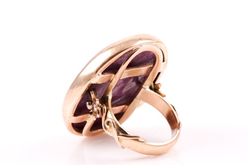 Lot 64 - A 9ct yellow gold and ruby ring, set with a...