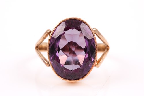 Lot 113 - A yellow gold and synthetic corundum ring,...