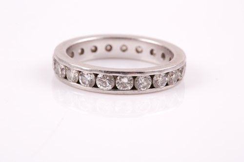 Lot 116 - A platinum and diamond eternity ring, set with...