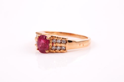 Lot 165 - An 18ct yellow gold, diamond, and ruby ring by...