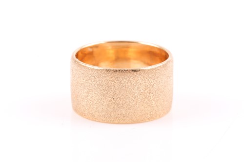 Lot 151 - An Italian 9ct yellow gold band ring, with...