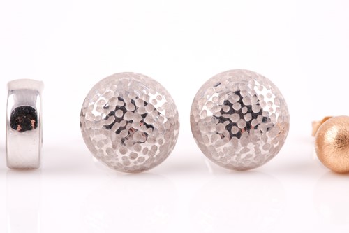 Lot 79 - A pair of white metal hollowed dome earrings,...