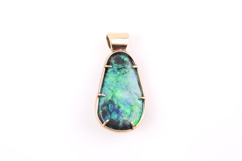 Lot 200 - A 14ct yellow gold mounted smooth boulder opal,...