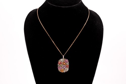 Lot 184 - A 9ct yellow gold and multi-gem floral pendant,...