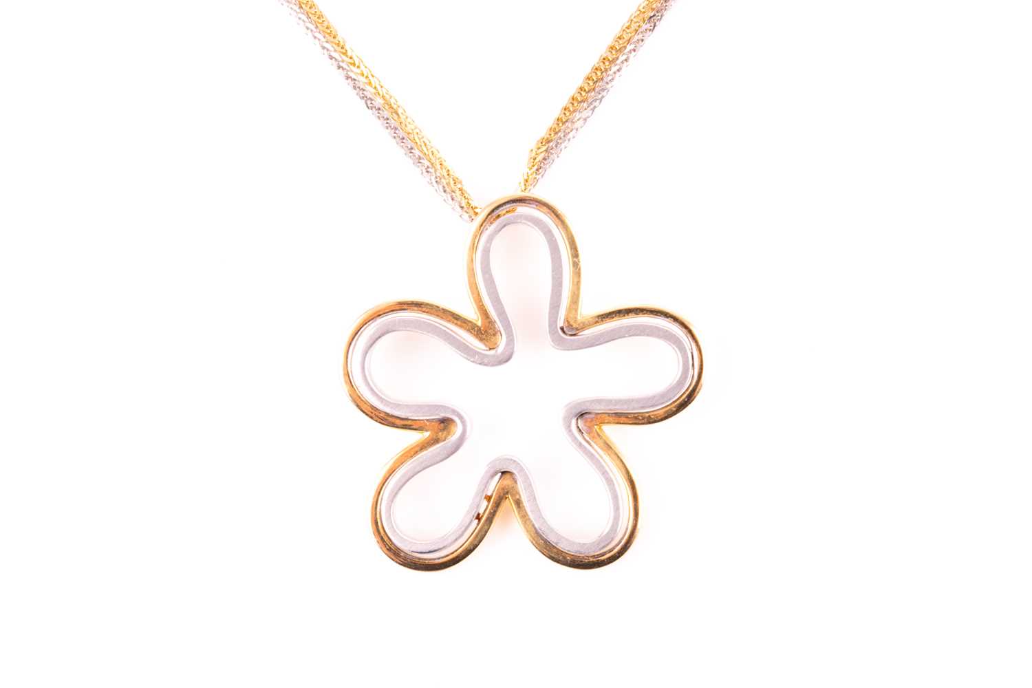 Lot 30 - An 18ct white and yellow gold floral splash...