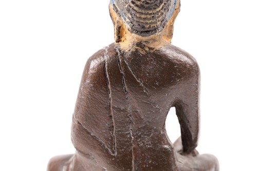 Lot 87 - A Tibetan patinated bronze figure of a Buddha...