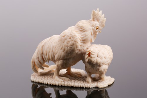 Lot 85 - A Japanese ivory okimono, Meiji period, carved...