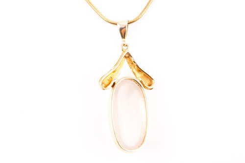 Lot 119 - A yellow metal and moonstone pendant, set with...